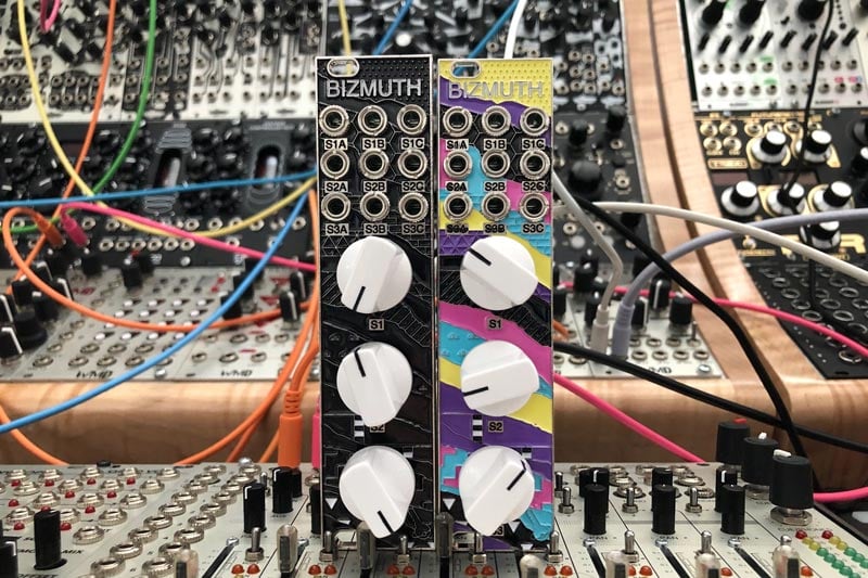 Black and classic colorful Bizmuth modules side by side.