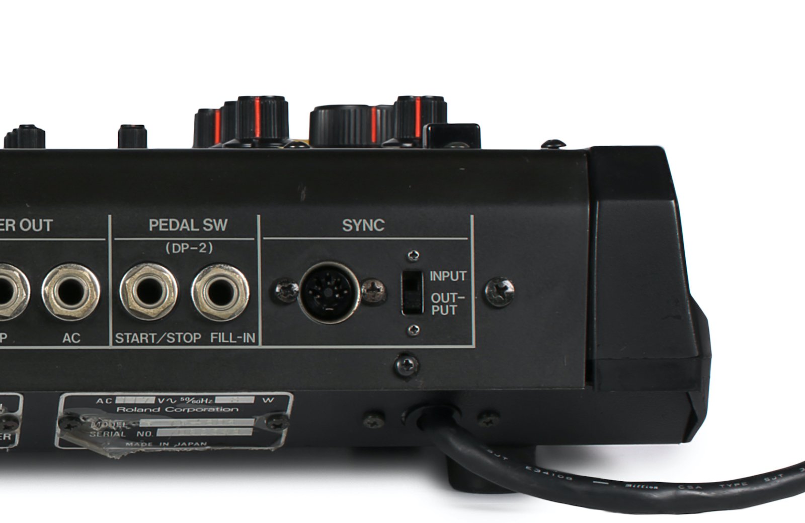 DIN Sync input/output jack on the rear panel of a vintage Roland TR-808.